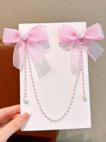 1 件女孩时尚优雅珍珠蝴蝶结珍珠流苏发夹。由于材料批次不同，可能会出现轻微色差，产品和包装卡为准。 - 粉色 - 查看 1