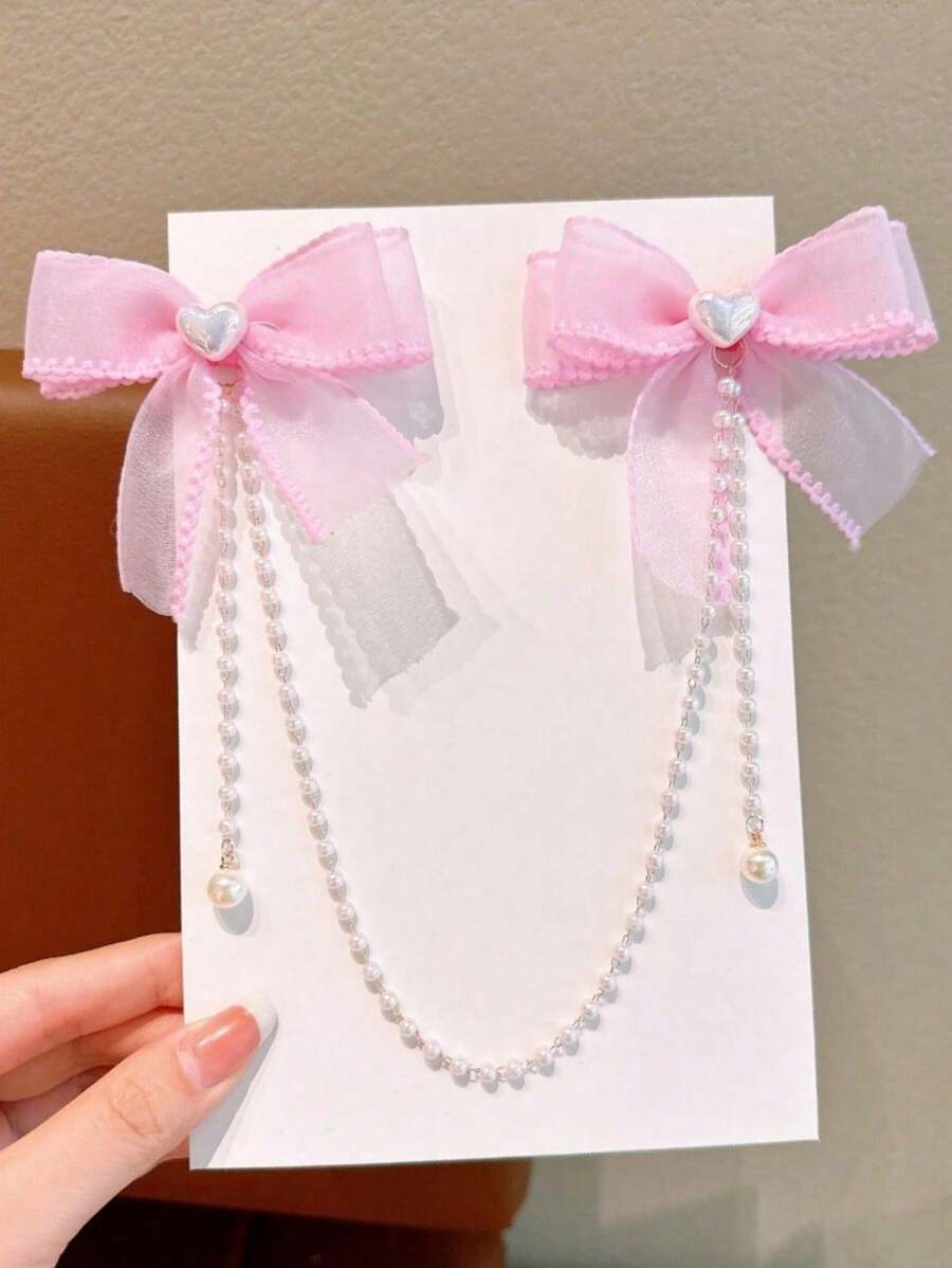 1 件女孩时尚优雅珍珠蝴蝶结珍珠流苏发夹。由于材料批次不同，可能会出现轻微色差，产品和包装卡为准。 - 粉色 - 查看 1