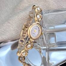 1 Đồng hồ thạch anh thanh lịch dành cho nữ có vỏ hợp kim hình bầu dục giống như vải sa tanh được đính kèm hạt đá quý có thể di chuyển, mặt đồng hồ họa tiết mặt trời có vạch pha lê - trắng - Xem 5