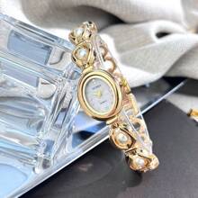 1 Đồng hồ thạch anh thanh lịch dành cho nữ có vỏ hợp kim hình bầu dục giống như vải sa tanh được đính kèm hạt đá quý có thể di chuyển, mặt đồng hồ họa tiết mặt trời có vạch pha lê - trắng - Xem 6