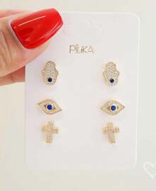 TRIO DE BRINCOS MIA OLHO GREGO MÃO HAMSA E CRUZ FOLHEADO A OURO 18K
