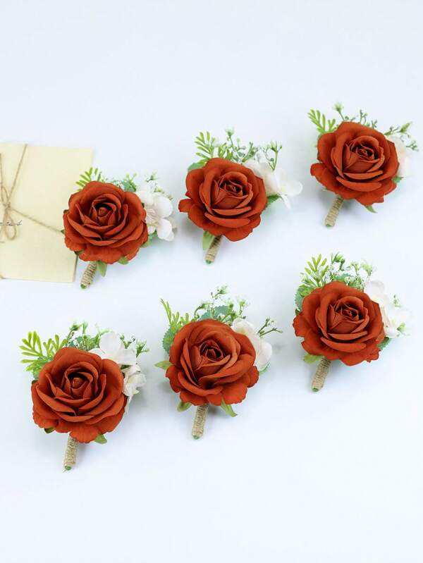 بوتونييه وردة أنيقة باللون البرتقالي والزهري مزينة بلمسات خضراء بيضاء، مثالي كوردون عرس وفعاليات رسمية مناسب للعريس والمرافقين والضيوف، أعياد، هالوين، عيد الحب