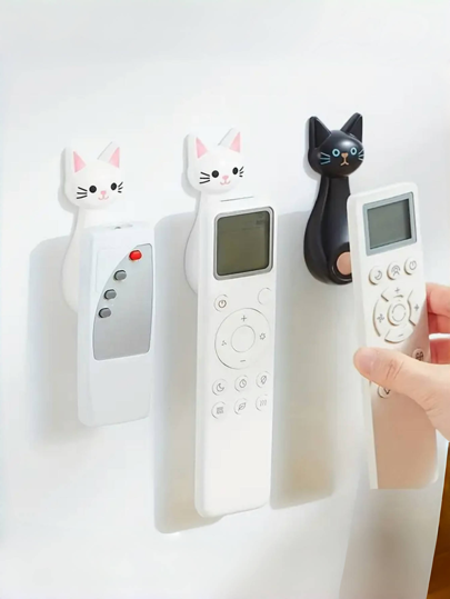 1 gancho magnético criativo, projetado especificamente para controles remotos, com adesivo forte para montagem na parede, design de desenho animado de gato fofo, perfeito para organizar controles remotos de TV e CA, sem deixar vestígios, adequado para projetor