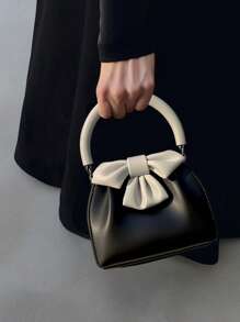 春夏新品优雅小众设计黑白撞色蝴蝶结手提包优雅时尚百搭高端优雅通勤单品简约日常逛街派对黑白