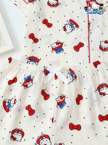 Set de 2 piezas de pijama con parte superior de manga corta con botones y bolsillo estampada con Hello Kitty de Sanrio, y shorts con lazo, adecuado para uso casual en casa, primavera/verano