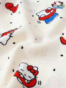 Set de 2 piezas de pijama con parte superior de manga corta con botones y bolsillo estampada con Hello Kitty de Sanrio, y shorts con lazo, adecuado para uso casual en casa, primavera/verano