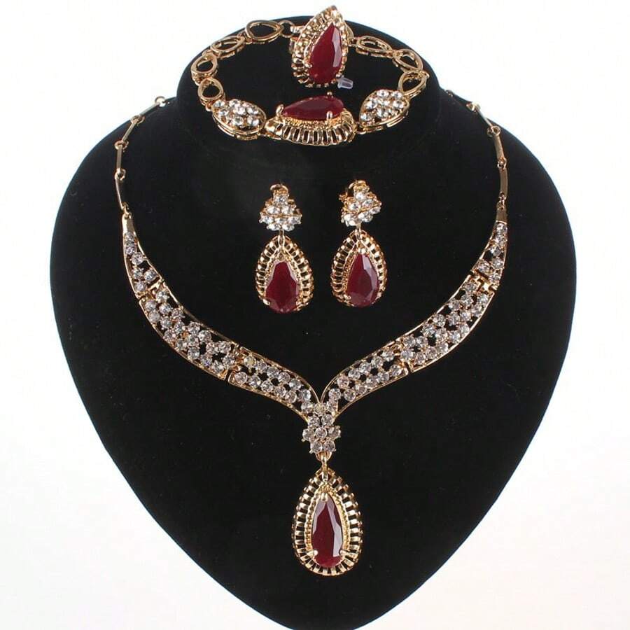 Juego de joyas de lujo con tono dorado y cristal rojo en forma de lágrima, que incluye collar, aretes, pulsera y anillo para mujeres, ideal para bodas, fiestas nupciales y bailes