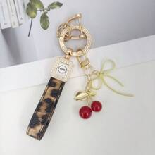 TTOBS 1pc Exquisitely Crafted Leopard Print Leather Car Key Chain With Adorable Cherry Pendant - , Fashionable And Multi-Functional Backpack Keychain - The Perfect Accessory For Backpacks. The Perfect Valentine's Day Gift, Also An Ideal Gift For Your Beloved Girlfriend.