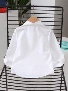 Camicia bianca a maniche lunghe con colletto versatile per ragazze, stile minimalista, indispensabile per la scuola e il casual