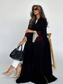 Vestido largo de estilo elegante con abertura frontal, de estilo moderno en Medio Oriente/Dubai, con mangas sobredimensionadas y diseño de empalme a la moda.