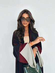 Vestido largo de estilo elegante con abertura frontal, de estilo moderno en Medio Oriente/Dubai, con mangas sobredimensionadas y diseño de empalme a la moda.