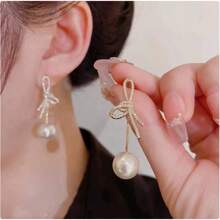 1 paire de boucles d'oreilles élégantes avec nœud papillon, strass et perles. Accessoires de bijoux polyvalents et pour femmes