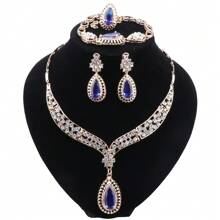 Juego de joyas de lujo con tono dorado y cristal rojo en forma de lágrima, que incluye collar, aretes, pulsera y anillo para mujeres, ideal para bodas, fiestas nupciales y bailes - juego de 4 piezas - Ver 17