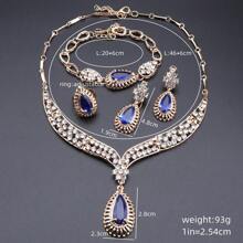 Juego de joyas de lujo con tono dorado y cristal rojo en forma de lágrima, que incluye collar, aretes, pulsera y anillo para mujeres, ideal para bodas, fiestas nupciales y bailes - juego de 4 piezas - Ver 7