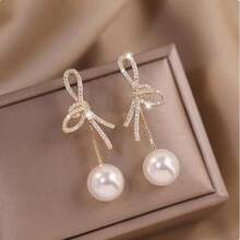 1 paire de boucles d'oreilles élégantes avec nœud papillon, strass et perles. Accessoires de bijoux polyvalents et pour femmes