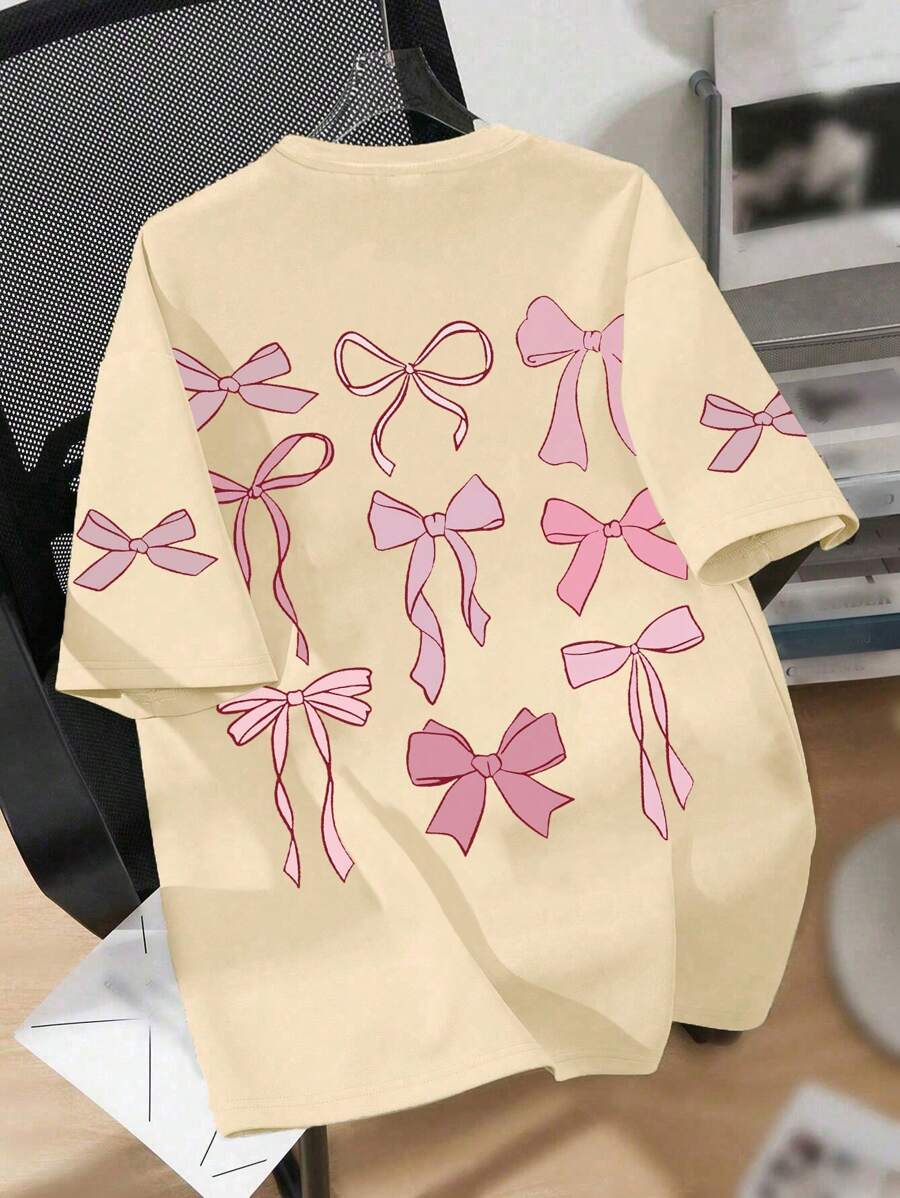 Maglietta a girocollo con stampa a fiocco cartoni animati, casual e morbida con maniche corte per l'estate, adatta per la scuola, lo shopping, lo stile di strada e le vacanze. Comoda maglietta a maniche corte estiva da ragazza, può essere un regalo per familiari e amici. Essenziale quotidiano lavabile in lavatrice, stile di strada. - Albicocca - Visualizzare 1