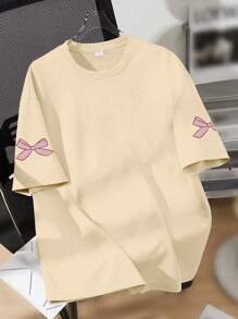 Maglietta a girocollo con stampa a fiocco cartoni animati, casual e morbida con maniche corte per l'estate, adatta per la scuola, lo shopping, lo stile di strada e le vacanze. Comoda maglietta a maniche corte estiva da ragazza, può essere un regalo per familiari e amici. Essenziale quotidiano lavabile in lavatrice, stile di strada. - Albicocca - Visualizzare 2