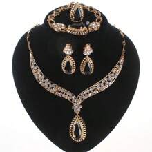 Juego de joyas de lujo con tono dorado y cristal rojo en forma de lágrima, que incluye collar, aretes, pulsera y anillo para mujeres, ideal para bodas, fiestas nupciales y bailes - juego de 4 piezas - Ver 16