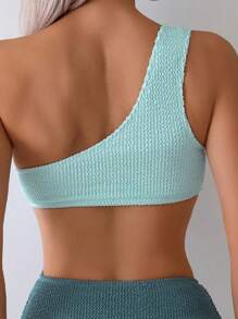 Nowy europejski i amerykański damski, elegancki, jednoczęściowy kostium kąpielowy z dzianiny na jedno ramię, wykonany z włókna poliestrowego i włókna elastycznego, o wysokiej elastyczności, w jednolitym kolorze, seksowny, jednoczęściowy kostium kąpielowy z wydrążonymi detalami.