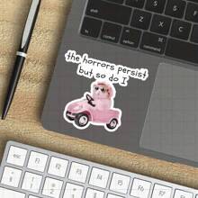 3-Inch "The Horrors Persist But So Do I Vinyl Sticker For Resilience Advocates, Humor Enthusiasts, And Quirky Decor Fans; Perfect For Laptop, Water Bottle, Notebook, And Personal Space Decor; Ideal As Motivational Sticker, Humorous Sticker, And Quirky Sticker; Embrace Your Strength, Personalize Your Accessories, Or Gift To Someone Who Appreciates Fun Designs; Great For Adults Seeking Encouragement, Humor, And Lighthearted Style."