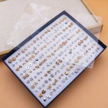 Set de 100 piezas de pendientes de studs pequeños de plástico con rhinestones de diseño aleatorio, surtidos, empaquetados en caja
