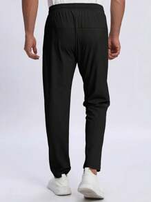 Lichtgewicht, ademende en elastische hardloopbroek voor heren met ritszakken en een tailleband met trekkoord. Zachte, vochtafvoerende ijszijde, modieuze effen sportbroek voor joggen, trainen, casual, vissen en dagelijks gebruik.