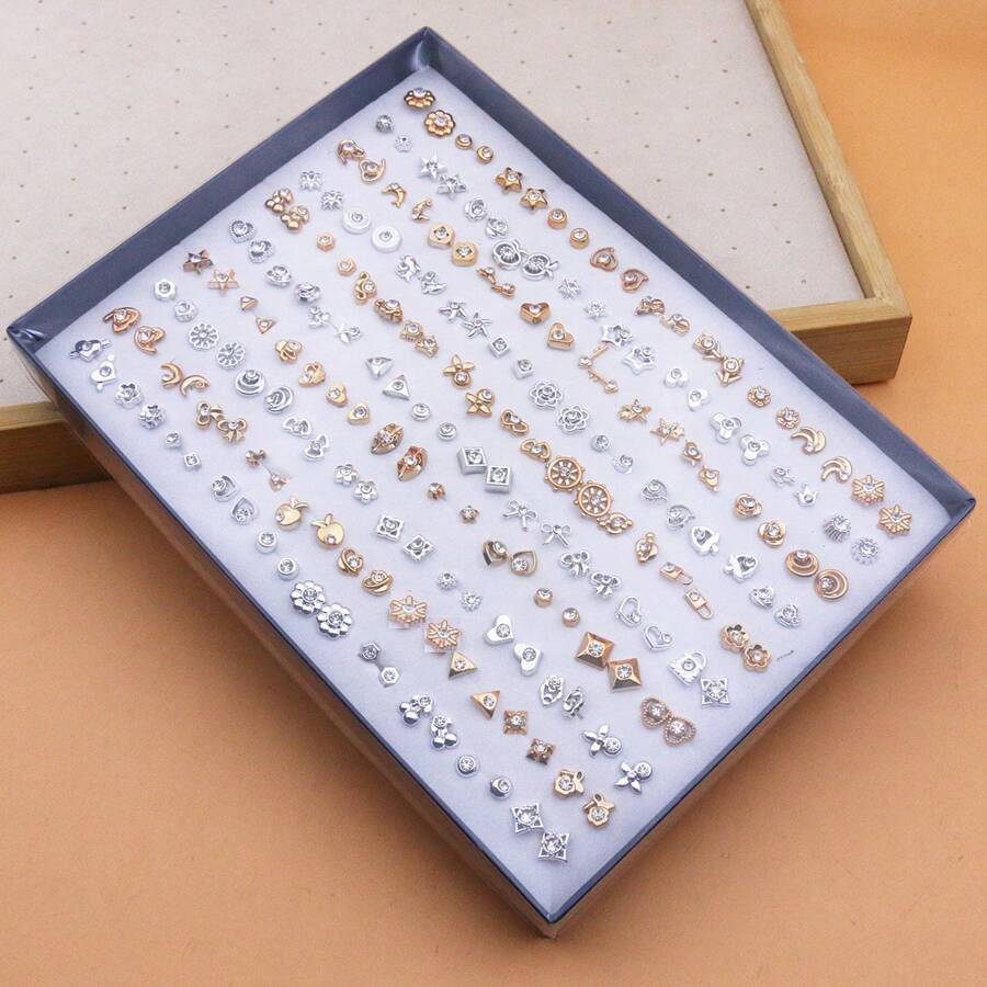 Set de 100 piezas de pendientes de studs pequeños de plástico con rhinestones de diseño aleatorio, surtidos, empaquetados en caja