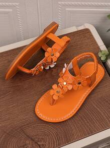 1 par de sandalias planas naranja para niñas de talla grande, con chanclas de piel de PU y hebilla de metal con rhinestones, 4 decoraciones de flores, espalda elástica, punta redonda y abierta, sandalias romanas adecuadas para niñas de 3 a 15 años para uso diario casual, fiesta, viaje, playa, primavera/verano 2025