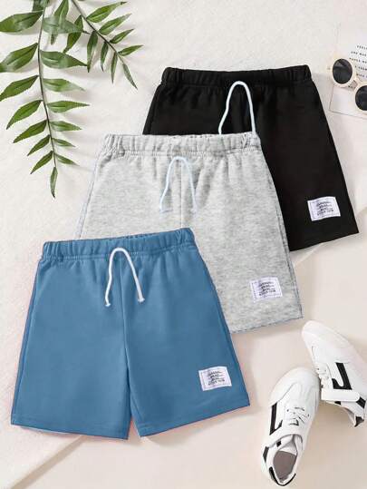 Conjunto de 3 piezas de ropa de primavera/verano para niños, estilo escolar, con pantalones cortos decorativos con cordón falso y estampado en inglés, adecuado para actividades al aire libre, vacaciones, senderismo
