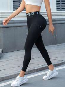 Damen Yoga Hose mit hoher Taille und Taschen, Leggings mit Buchstaben-Taillenbund, enge Sporthose aus bequemem, dehnbarem Stoff für Fitness, Gym, sportlich-lässigen Alltag - Schwarz - Übersicht 1