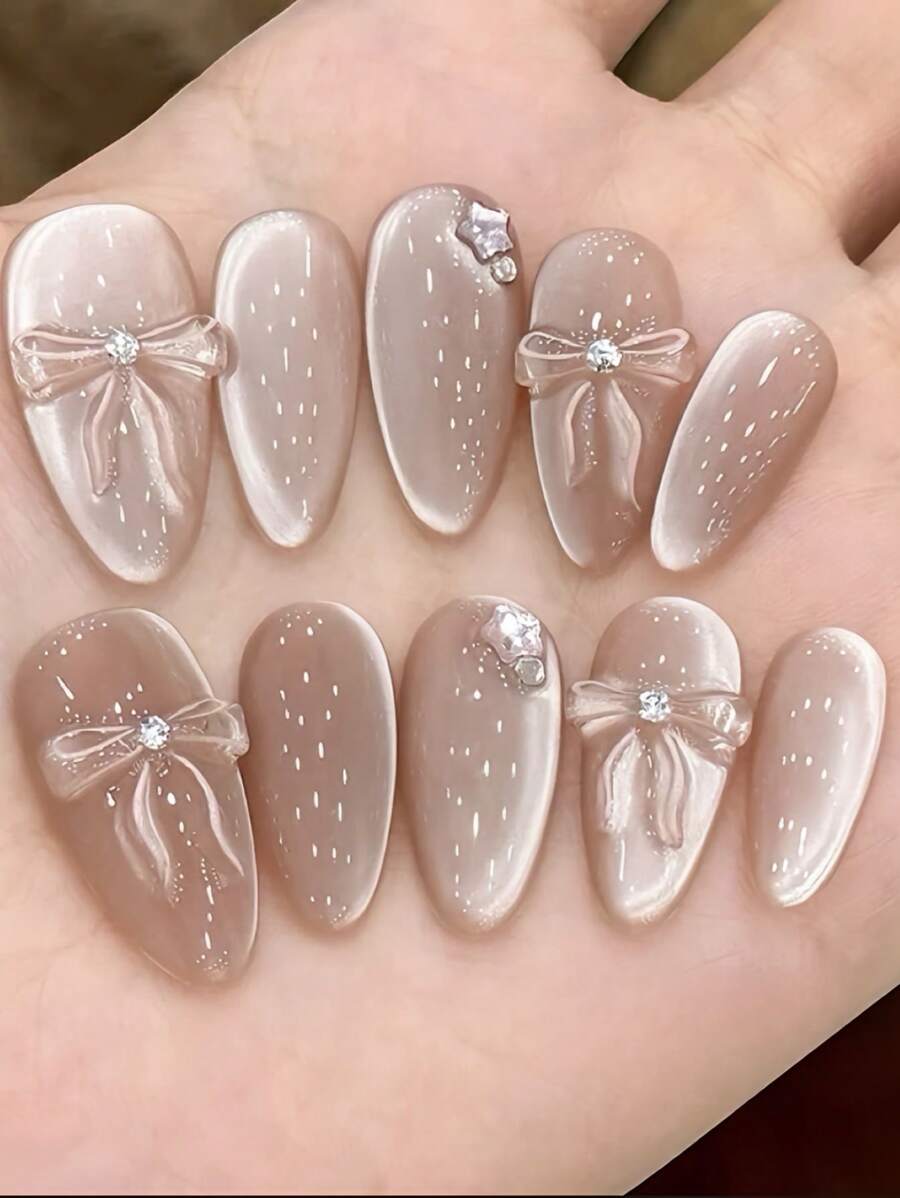 10片猫眼美甲贴纸，中长款，高品质，精致婚礼美甲，手工蝴蝶结装饰，适合女孩或女士在节日、母亲节或特殊场合佩戴，可用作礼物或美甲用品。