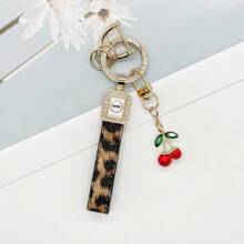 TTOBS 1pc Exquisitely Crafted Leopard Print Leather Car Key Chain With Adorable Cherry Pendant - , Fashionable And Multi-Functional Backpack Keychain - The Perfect Accessory For Backpacks. The Perfect Valentine's Day Gift, Also An Ideal Gift For Your Beloved Girlfriend.