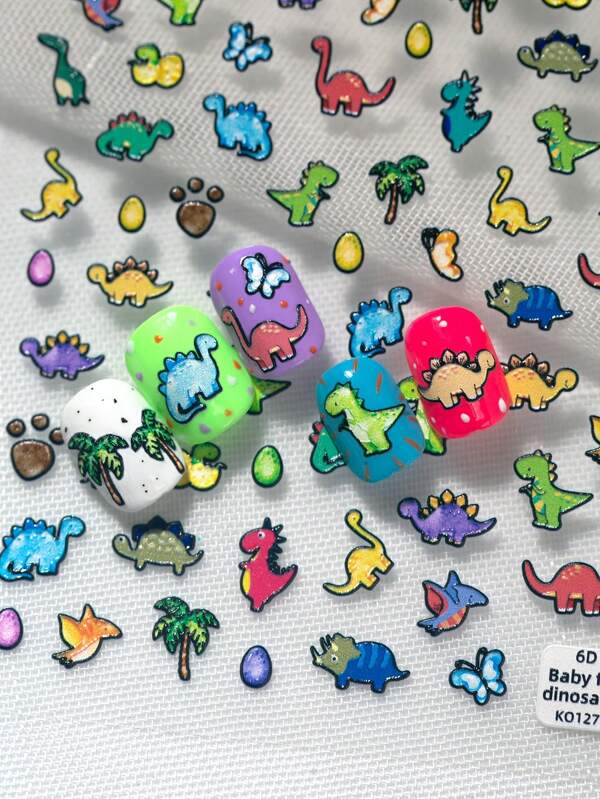 Pegatinas populares y lindas de dinosaurios de diferentes colores y variedades de dinosaurios de dibujos animados para decorar las uñas en el salón de belleza