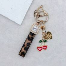 TTOBS 1pc Exquisitely Crafted Leopard Print Leather Car Key Chain With Adorable Cherry Pendant - , Fashionable And Multi-Functional Backpack Keychain - The Perfect Accessory For Backpacks. The Perfect Valentine's Day Gift, Also An Ideal Gift For Your Beloved Girlfriend.