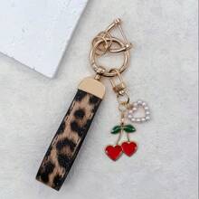 TTOBS 1pc Exquisitely Crafted Leopard Print Leather Car Key Chain With Adorable Cherry Pendant - , Fashionable And Multi-Functional Backpack Keychain - The Perfect Accessory For Backpacks. The Perfect Valentine's Day Gift, Also An Ideal Gift For Your Beloved Girlfriend.