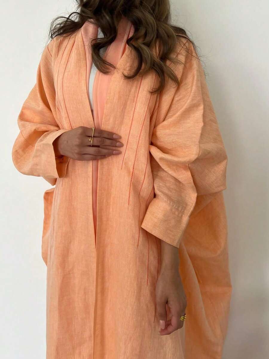 1 件女士纯色简约长款 Abaya，优雅适度休闲开衫，线条装饰拼接艺术感，高端亚麻面料柔软光泽丝滑适度适合日常穿着，长袍