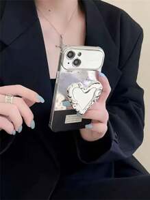 1 件心形镜面气囊手机支架，电镀亮银色创意酷炫风格小众高审美 Ins 风格，便携式补漆工具，舒适的桌面支架，可伸缩推拉手感，背贴+支架二合一，美观实用，自拍和视频首选，贴纸无痕迹或残留，可搭配不同颜色的手机壳，适用于几乎所有手机