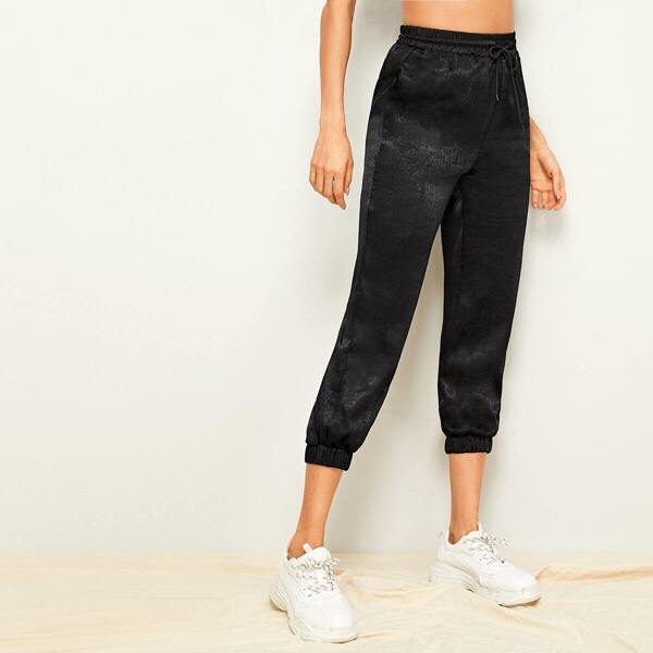 

Drawstring Waist Solid Tapered Pants