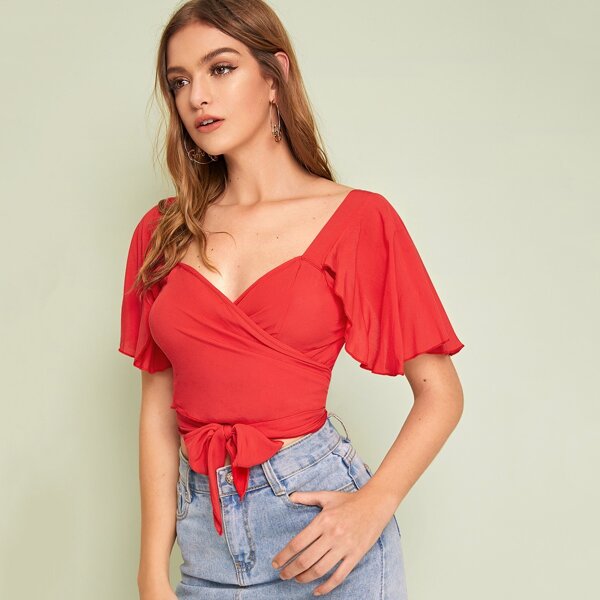 

Solid Ruffle Trim Wrap Tie Front Top