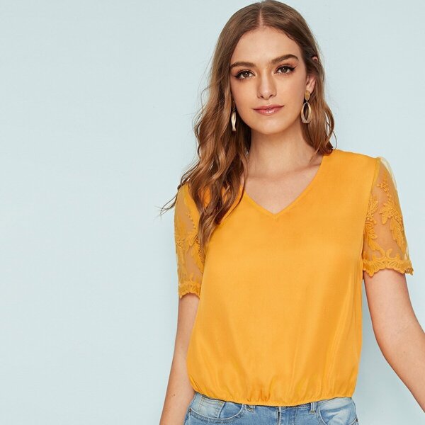 

Solid Embroidered Mesh Sleeve Top