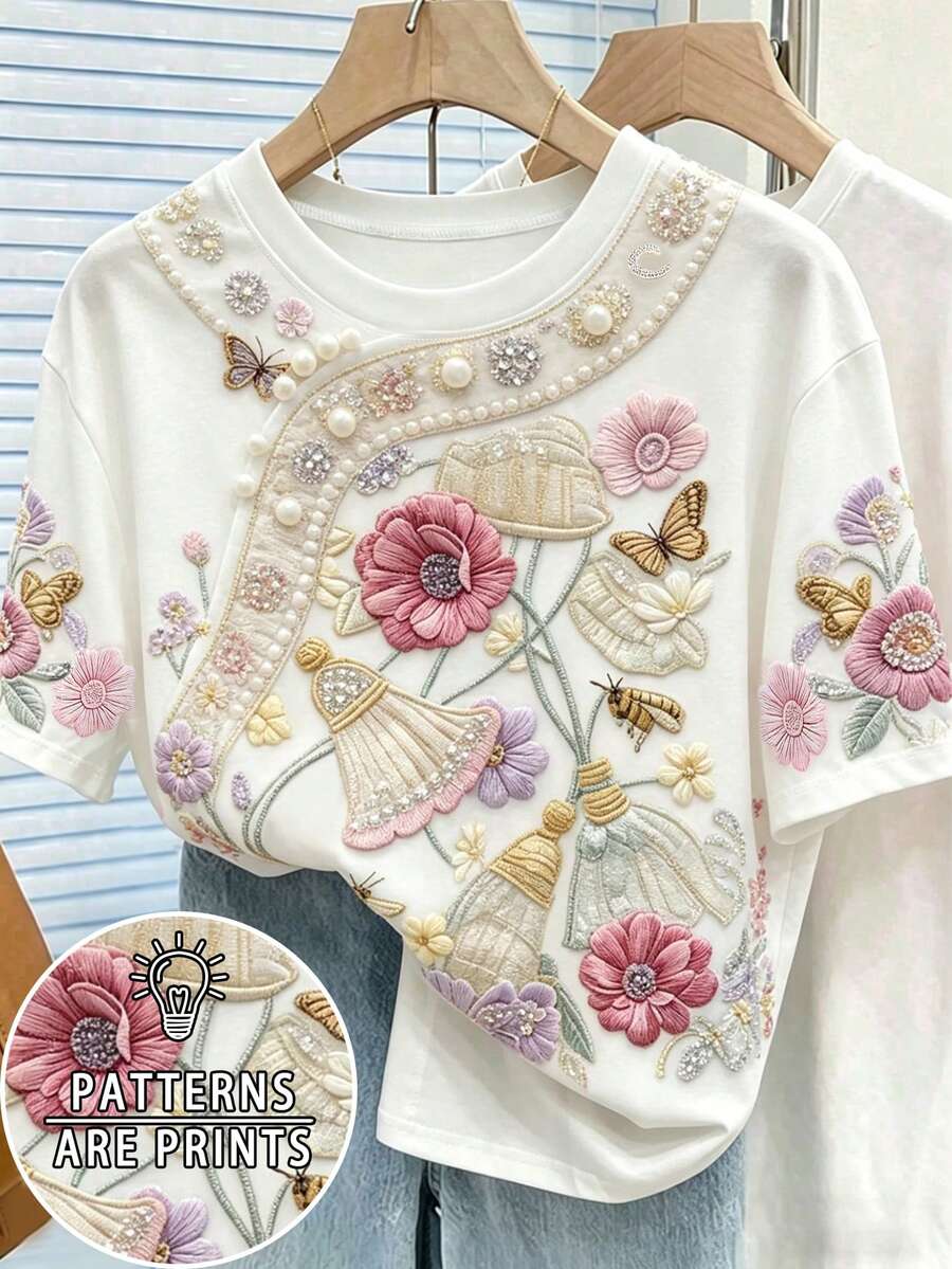 Resyla 花卉、蝴蝶和流苏仿珍珠刺绣印花大码女式休闲圆领短袖T恤,白色花卉图案上衣,适合夏季日常穿着和度假。 - 黑色 - 查看 1