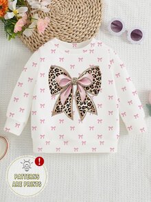 SHEIN 女童時尚清新亮面豹紋蝴蝶結白色底粉色蝴蝶結圖案印花基本款圓領運動衫，秋季休閒日常穿搭 - 彩色 - 查看 1