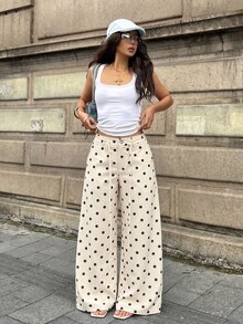 Coolane 女款秋冬外出休閒街頭風性感Y2K時尚度假日常穿搭可愛學院風奶油黃波點細肩帶直筒長褲 - 黑與白 - 查看 5