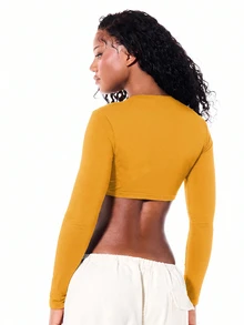 SUMWON WOMEN Long Sleeve Deep V-Neck Twist Front Crop Top With Cursive Script Print Festival Party Spring Summer Night Out - Yellow - View 2
