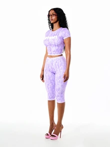 SUMWON WOMEN Lavender Camo Print Crew Neck Short Sleeve Cropped T-Shirt With Chest Logo Detail Summer Ready Workout Gym Streetwear Sport - Lilac Purple - View 4