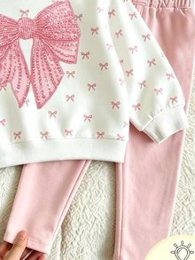 Conjunto de sudadera con estampado de lazos dulces para niñas, top de cuello redondo de manga larga en color blanco crema con pequeños lazos rosas y estampado de lazos de lentejuelas falsas en el pecho, combinado con pantalones ajustados de color rosa claro sólido, ajuste holgado y cómodo, estilo coreano fresco, conjunto casual de 2 piezas para niñas en primavera/otoño/invierno, fácil de combinar y combinar - Multicolor - Ver 3