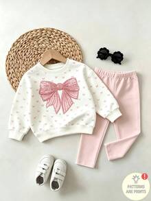 Conjunto de sudadera con estampado de lazos dulces para niñas, top de cuello redondo de manga larga en color blanco crema con pequeños lazos rosas y estampado de lazos de lentejuelas falsas en el pecho, combinado con pantalones ajustados de color rosa claro sólido, ajuste holgado y cómodo, estilo coreano fresco, conjunto casual de 2 piezas para niñas en primavera/otoño/invierno, fácil de combinar y combinar - Multicolor - Ver 4