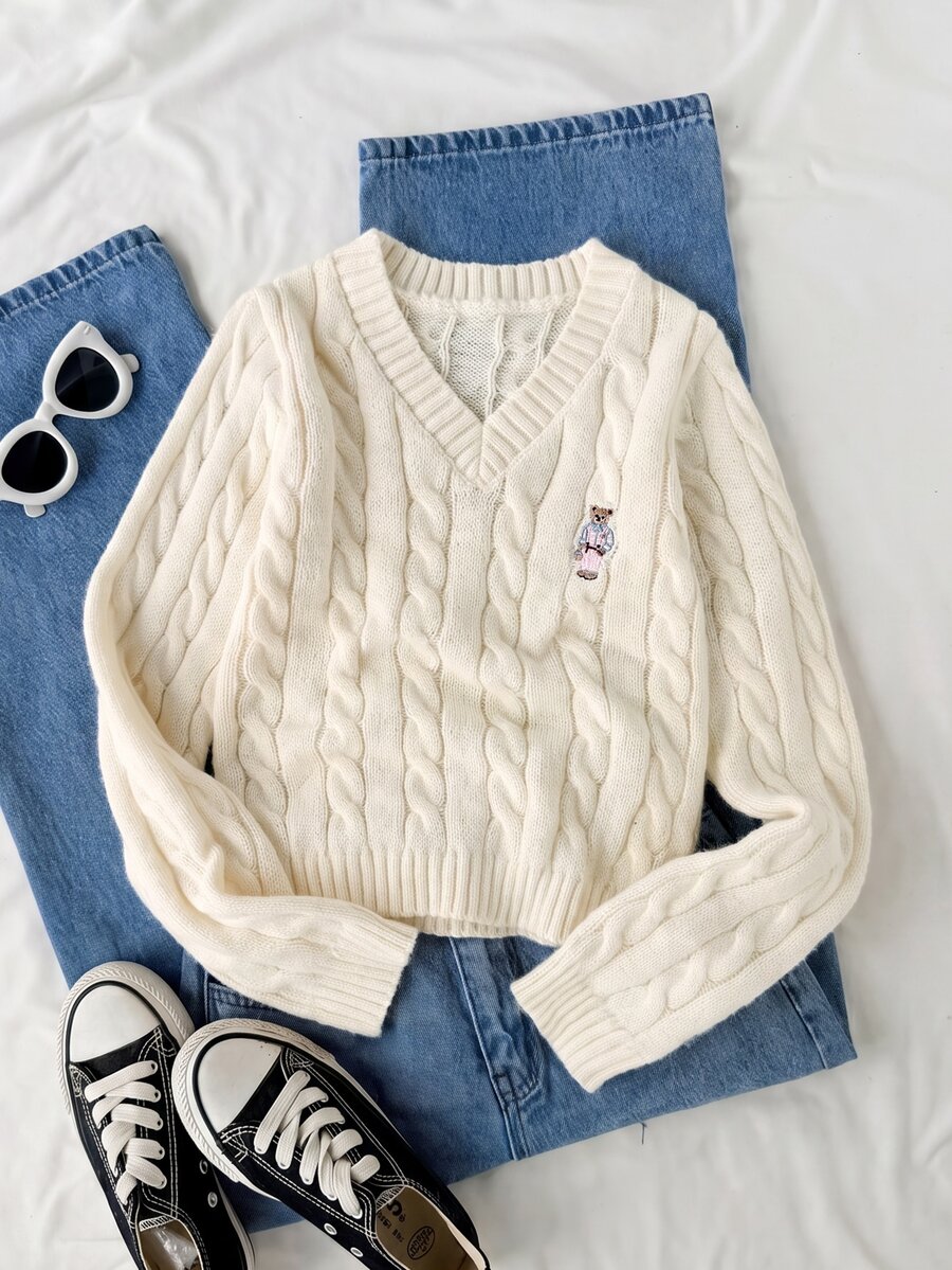 SHEIN 1件女童毛衣,時尚百搭V領復古麻花編織,可愛熊刺繡圖案,休閒學院風,適中厚度,整齊下擺,緊口袖口,手感順滑,短版純色套頭衫,適合日常穿著、上學、出遊、旅行等場合,秋冬穿搭 - 杏色 - 查看 1