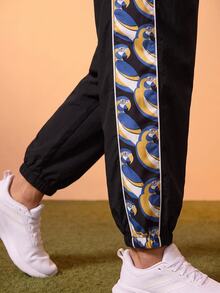 CAJUNI Women's Jogger Pants With Drawstring Waist And Blue Macaw Tropical Print - Black - View 6