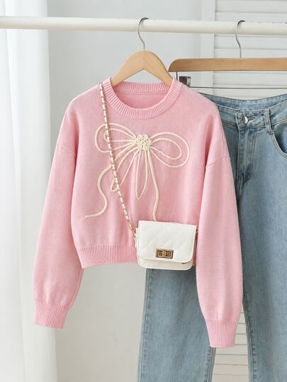 SHEIN Sweater Rajut Pendek Leher Bulat Warna Pink Muda untuk Anak Perempuan Usia 8-12 Tahun, Musim Gugur/Dingin 2026, dengan Hiasan Bordir Pita Tali Tebal 3D Warna Putih Krem, Pullover Lengan Panjang Longgar dengan Bahu Jatuh, Atasan Dalaman Lembut dan Manis untuk Sekolah, Jalan-jalan, Foto, Musim Semi dan Musim Gugur